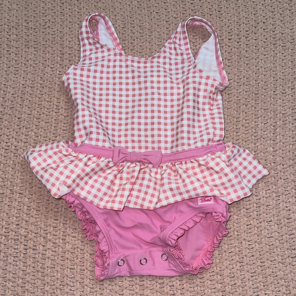 12-18 month Ruffle Butts pink and white Bingham one piece swimsuit.